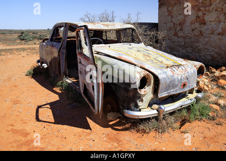 Derelict car next to old water tank and ruins Silverton near Broken Hill New South Wales Australia Stock Photo