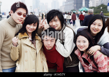 Portrait of three young men and three young women smiling Stock Photo