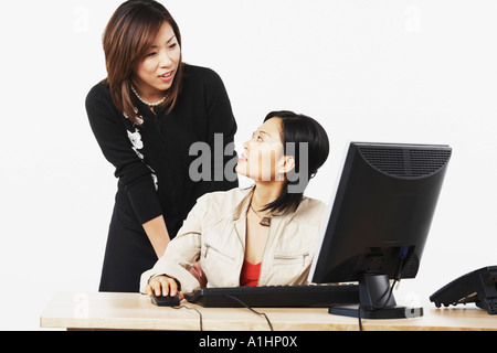 Close-up of two businesswomen looking at each other Stock Photo