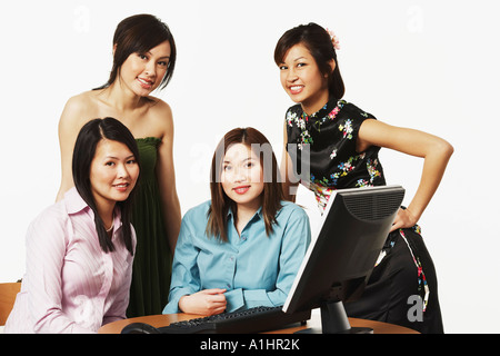 Portrait of four businesswomen smiling Stock Photo