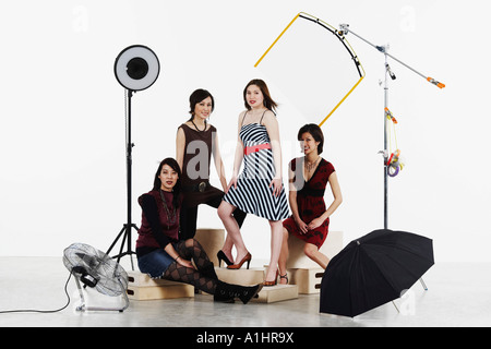 Portrait of four young women smiling Stock Photo