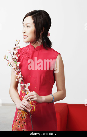 Young woman holding flowers Stock Photo
