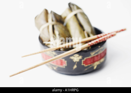 High angle view of food in a bowl with a pair of chopsticks Stock Photo