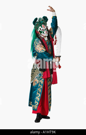 Portrait of a male Chinese opera performer standing holding a sword Stock Photo