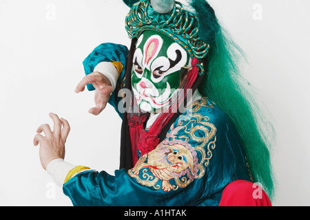 Portrait of a male Chinese opera performer gesturing with his hands Stock Photo