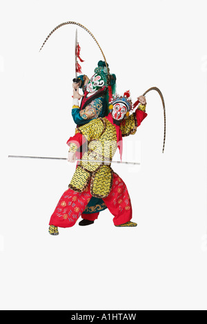 Two male Chinese opera performers gesturing with weapons Stock Photo