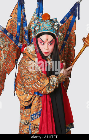 Close-up of a male Chinese opera performer holding a weapon Stock Photo