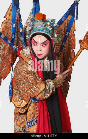 Close-up of a male Chinese opera performer holding a weapon Stock Photo