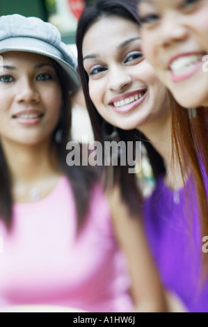 Portrait of three young women smiling Stock Photo