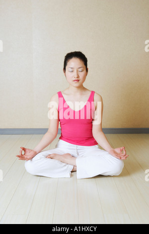Teenage girl meditating Stock Photo