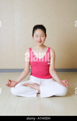 Teenage girl meditating Stock Photo