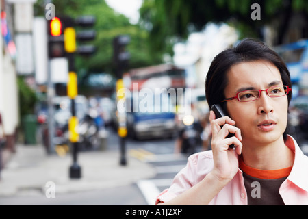 Close-up of a mid adult man talking on a mobile phone Stock Photo