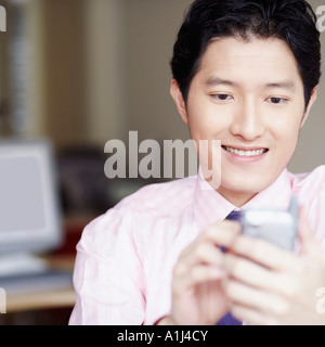 Close-up of a businessman operating a personal data assistant with a digitized pen Stock Photo