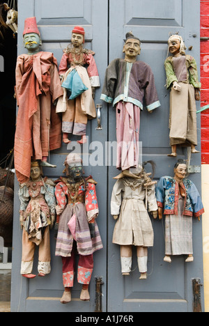 Traditional string puppets for sale hang on a tourist shop door, Pyin U Lwin Myanmar   2006 Stock Photo