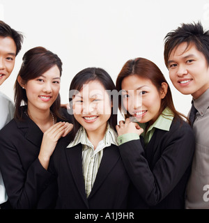 Portrait of three businesswomen and two businessmen smiling Stock Photo