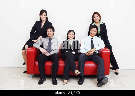 Portrait of three businesswomen and two businessmen smiling Stock Photo