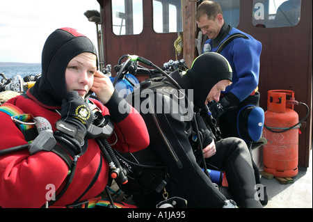 Divers prepare to scuba dive the war ships of Scapa Flow in Orkney Scotland UK Stock Photo