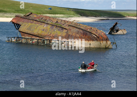 The wreckage of the Churchill Barrier blockships sunk during the second world war in Orkney Scotland UK Stock Photo