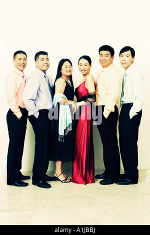Portrait of a group of business executives standing in a row and posing Stock Photo