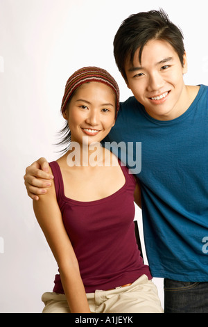Portrait of a young couple posing and smiling Stock Photo