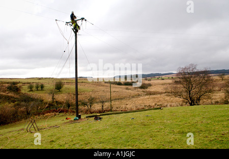 Engineers install electrical power lines to the Nedd Valley near Ystradfellte Powys Wales UK Stock Photo