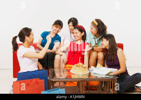 Young woman celebrating her birthday with her friends Stock Photo