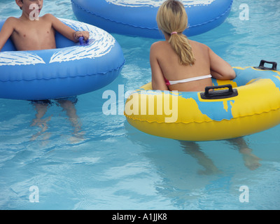 Teenage Boy In Yellow Swimming Trunks Goggles And Blue Cap Standing With Towel Over His Shoulder And Hands On Waist Front View Stock Photo Alamy