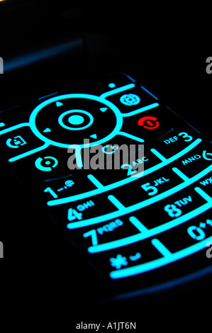 Illuminated keypad of mobile phone againt a black background Stock Photo -  Alamy