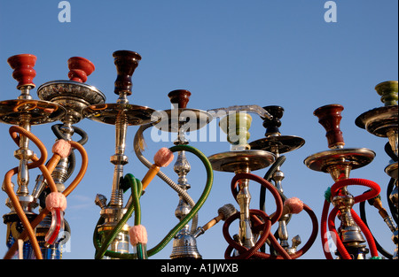 Stack of hookah pipes also known as a water pipe, Narghile,  nargeela, narghileh or nargile popular for smoking in the Arab Middle East Stock Photo