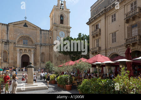 Restaurant and St John's Co Cathedral, St John's Square, Valletta, Malta Stock Photo