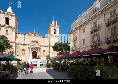 Restaurant and St John's Co Cathedral, St John's Square, Valletta, Malta Stock Photo