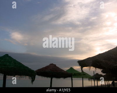 Parasols at Dusk, La Cala beach,  La Cala, de Mijas , Spain, Costa del Sol, Andalucia, Andalusia Spain Spanish  Med Stock Photo
