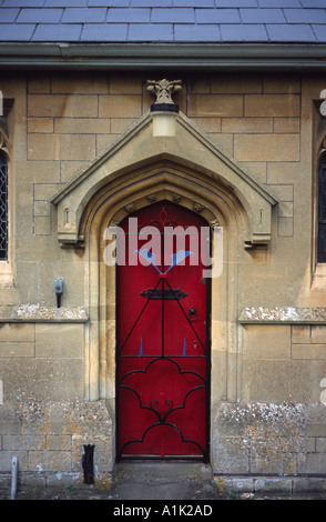 Red door St Nicholas Church Bathampton Bath Spa, Somerset, England UK Stock Photo