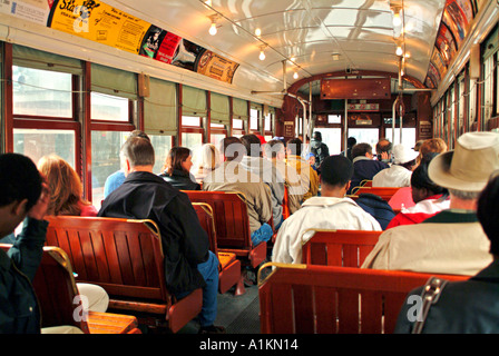 Interior of New Orleans streetcar with passengers Stock Photo