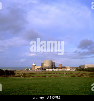 Wylfa Nuclear Power Station in the rural country landscape with blue sky in Anglesey Gwynedd North Wales UK  KATHY DEWITT Stock Photo