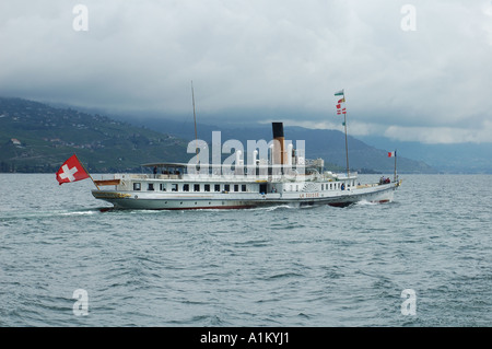 Paddle steamer 'La Suisse' on lac Leman (Lake Geneva), under grey skies Stock Photo