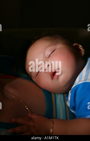 infant Baby Sleeping asleep on Moms Mothers Chest Stock Photo