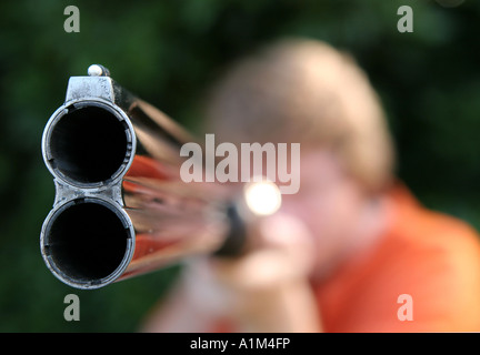 Looking down the  barrel of a double barrel shotgun. Stock Photo