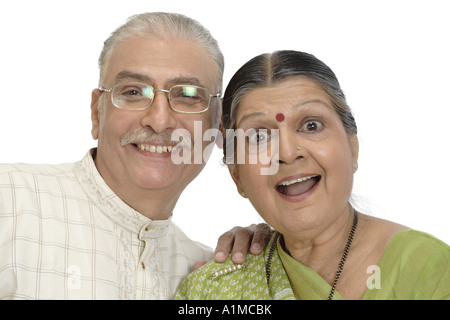 Happy Indian senior citizen couple on white background Stock Photo