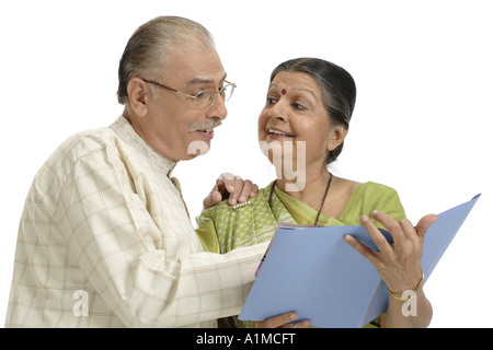 Indian senior citizen couple on white background Stock Photo