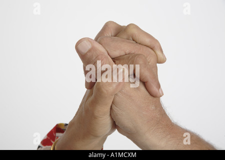 ANG201365 Hands of old man and woman holding tight to each other Stock Photo
