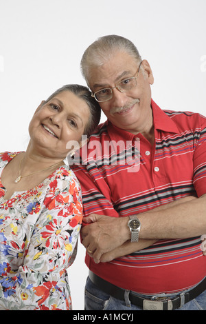 Loving Indian senior citizen couple husband wife say cheers with Stock