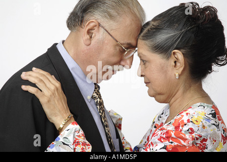 old couple touching foreheads Stock Photo