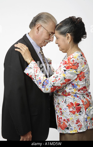 Loving Indian senior citizen couple husband wife head to head Stock Photo
