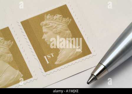 United Kingdom First Class Postage Stamp and Pen Stock Photo