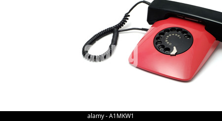 Red Telephone Against a White Background Stock Photo