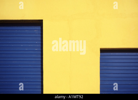 Southern France abstract colour study of roller shutter doors on small industrial unit in Southern France Stock Photo