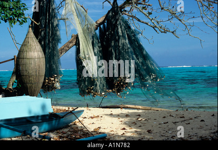 Fishing nets drying on the beach on Manihi Island in the french polynesian group Stock Photo