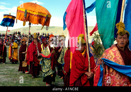 monks of the ancient Bon religion play a traditional role as they parade at the Naqu,Nagqu annual horse festival,Northern Tibet Stock Photo