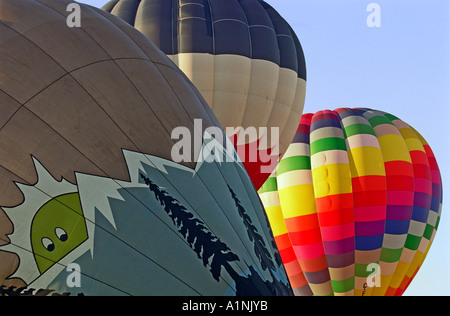 Three hot air balloons take off on a sunny morning in Calgary Stock Photo